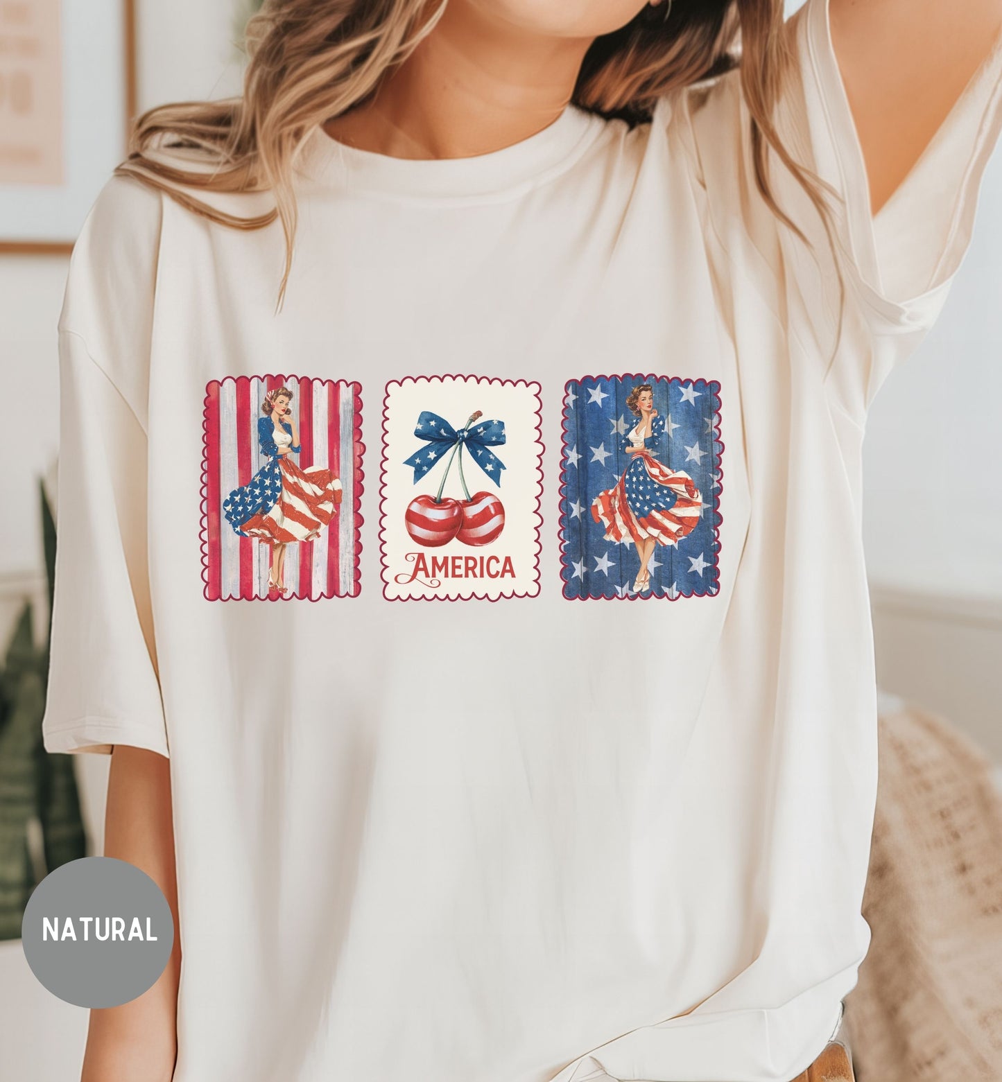 White t-shirt with patriotic graphic design featuring women, an American flag, and the word 'America'.