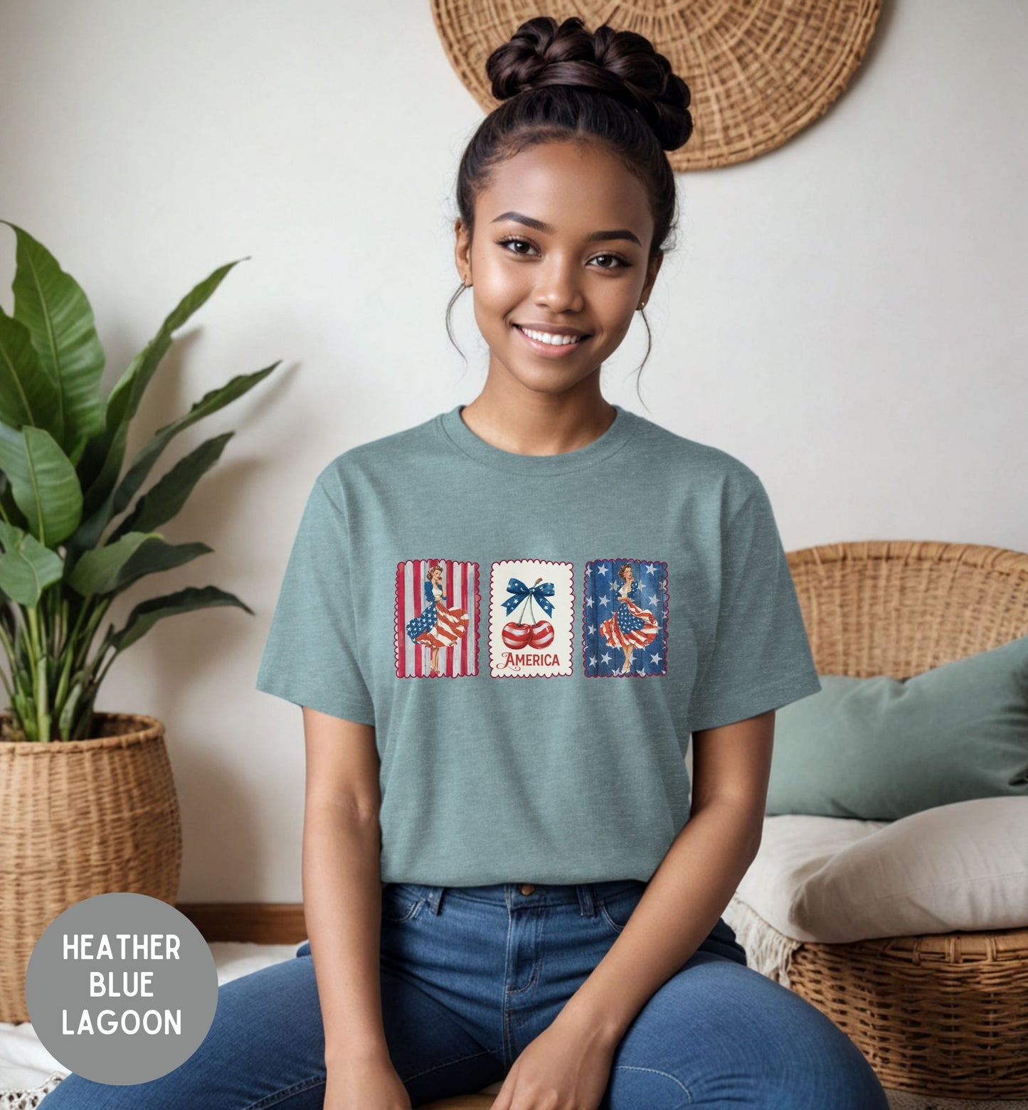 Woman wearing a heather blue lagoon t-shirt with graphic designs, sitting in a cozy room.