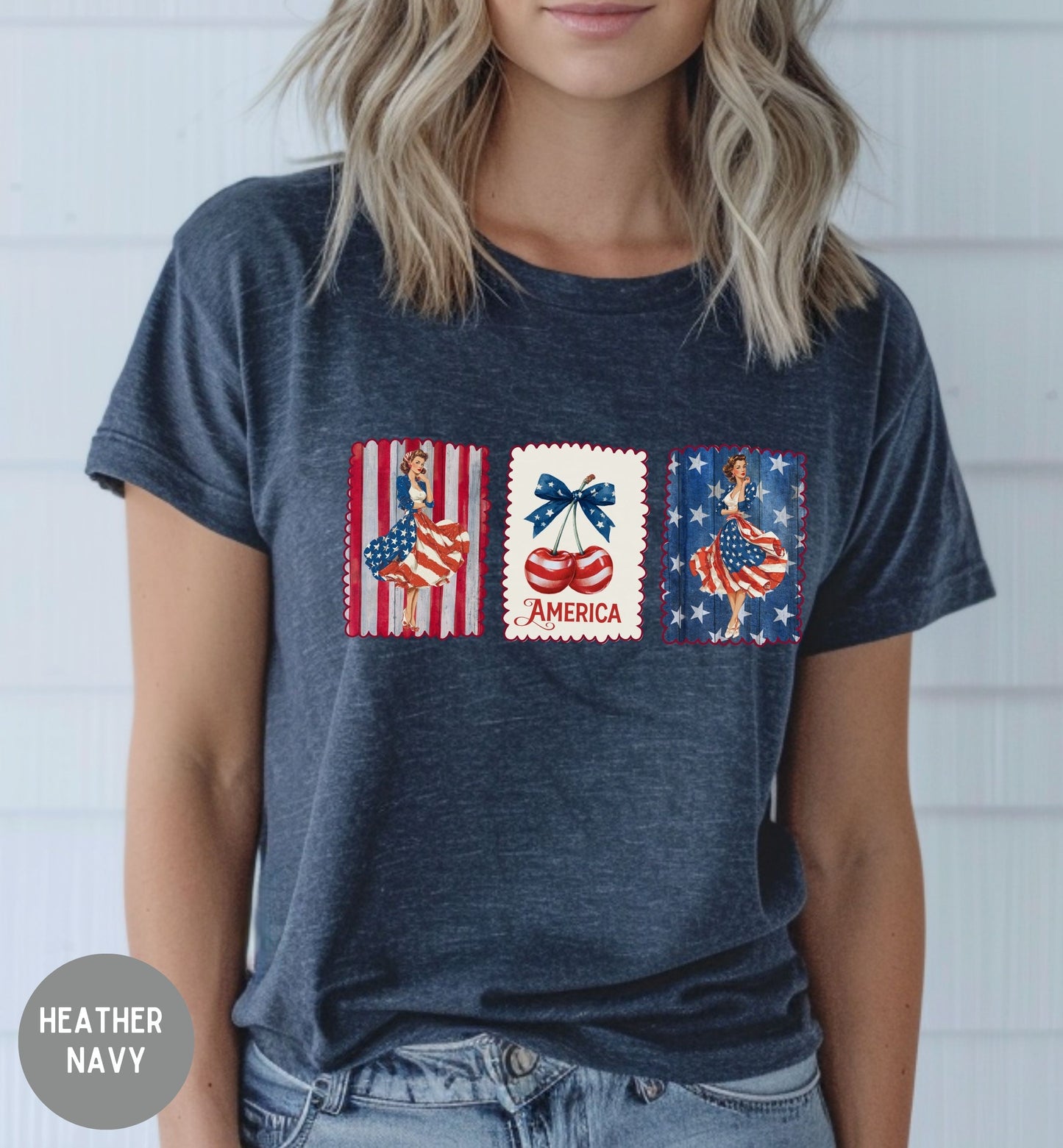 Person wearing a heather navy t-shirt with patriotic graphic design.