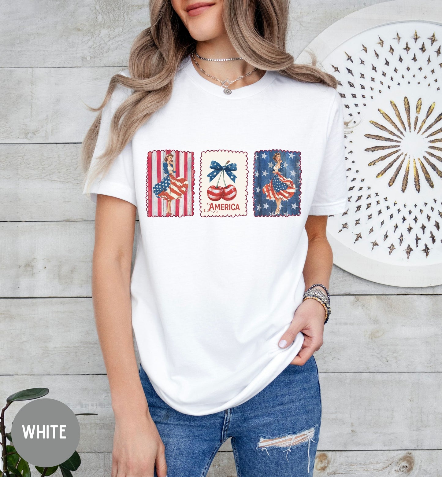 Person wearing a white t-shirt with graphic designs on a wooden background