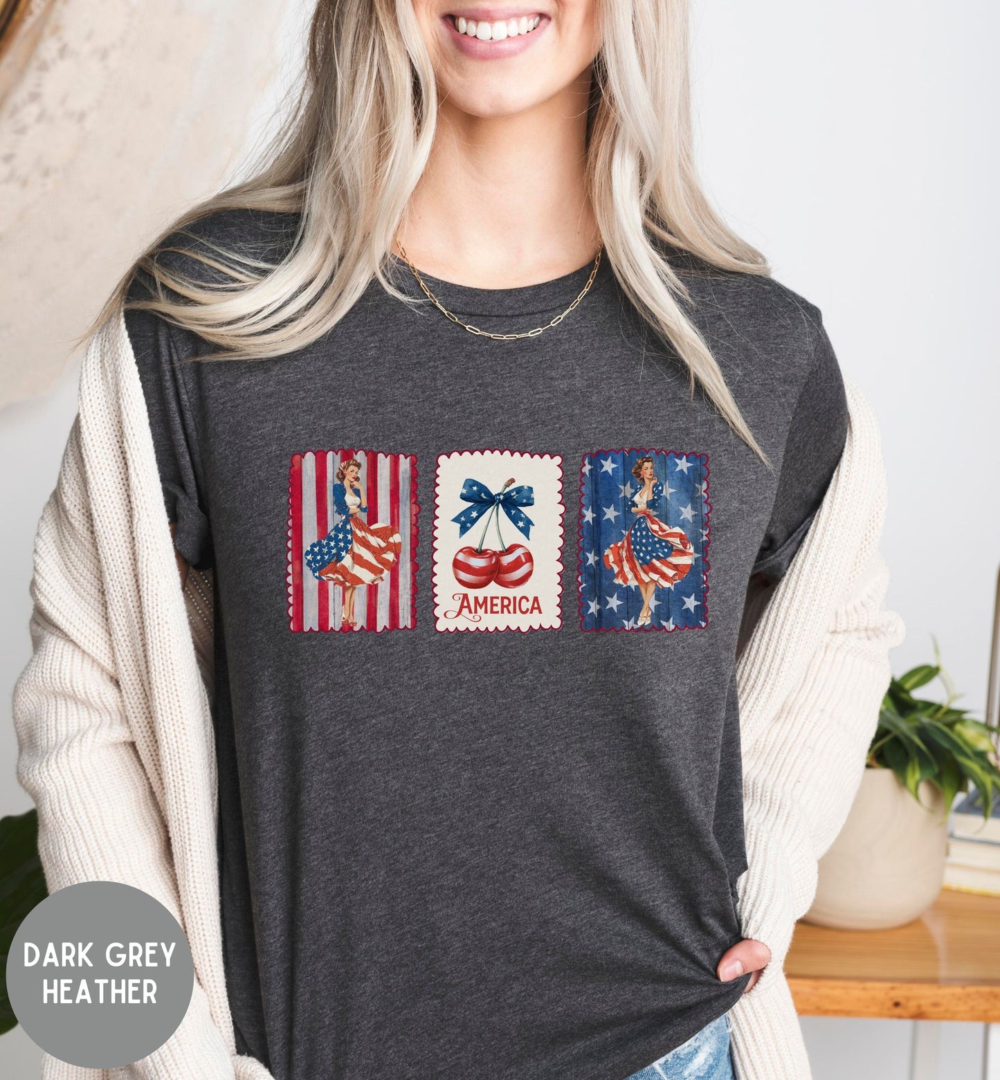 Person wearing a dark grey heather t-shirt with graphic designs and text.